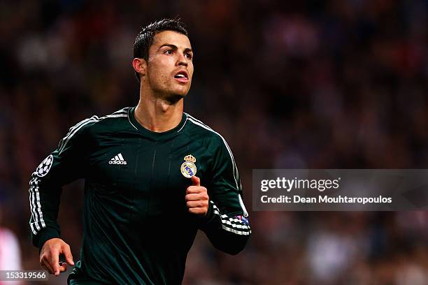 Cristiano Ronaldo of Real celebrates after he scores the fourth goal of the game during the UEFA Champions League Group D match between Ajax...