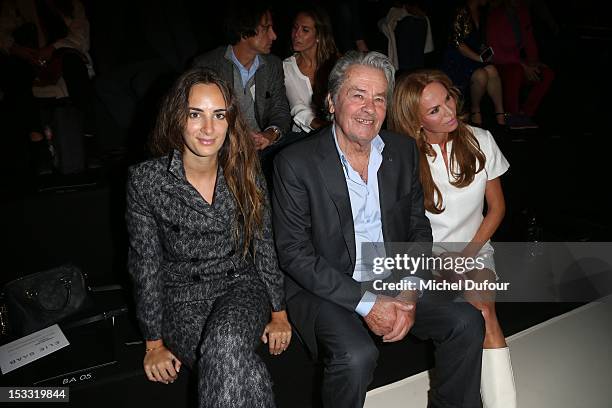 ALexia Niedzielski, Alain Delon and Rosalie van Breemen attend the Elie Saab Spring/Summer 2013 show as part of Paris Fashion Week at Espace Ephemere...