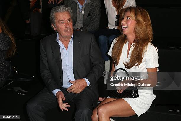 Alain Delon and Rosalie Van Breemen attend the Elie Saab Spring/Summer 2013 show as part of Paris Fashion Week at Espace Ephemere Tuileries on...