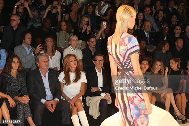 Alain Delon and Rosalie van Dreemen attend the Elie Saab Spring/Summer 2013 show as part of Paris Fashion Week at Espace Ephemere Tuileries on...