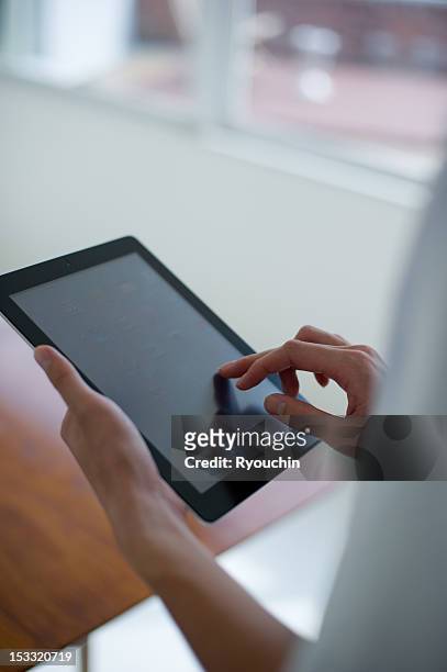 tablet - ipad vertical stock pictures, royalty-free photos & images
