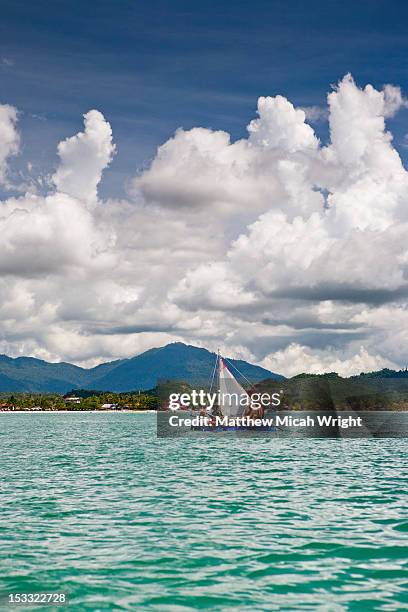sailing on a makeshift handmade raft. - langkawi stock-fotos und bilder