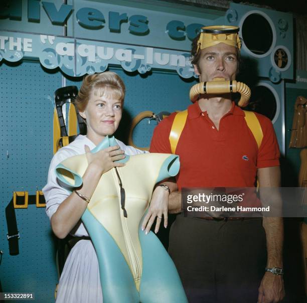 American actor Clint Eastwood and his first wife Maggie Johnson shopping for scuba diving equipment, circa 1960.