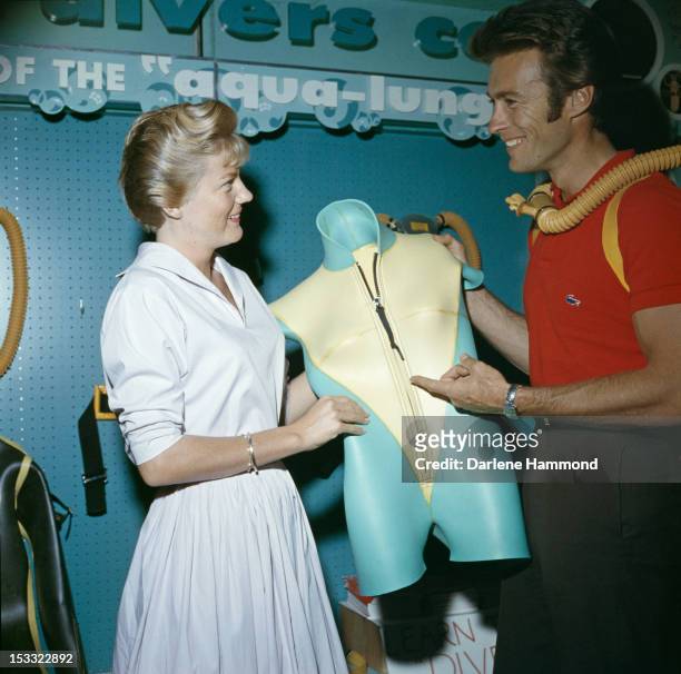 American actor Clint Eastwood and his first wife Maggie Johnson shopping for scuba diving equipment, circa 1960.