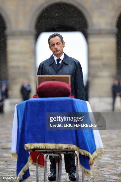 French President Nicolas Sarkozy pays his respects in the Invalides yard on July 19, 2011 in Paris, after the funeral service dedicated to the seven...