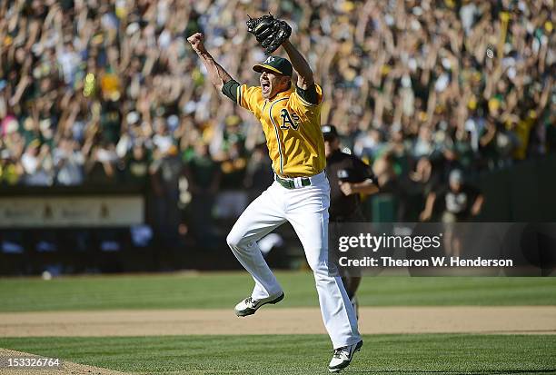 Pitcher Grant Balfour of the Oakland Athletics celebrates defeating the Texas Rangers 12 to 5 and capturing the American League West title at O.co...