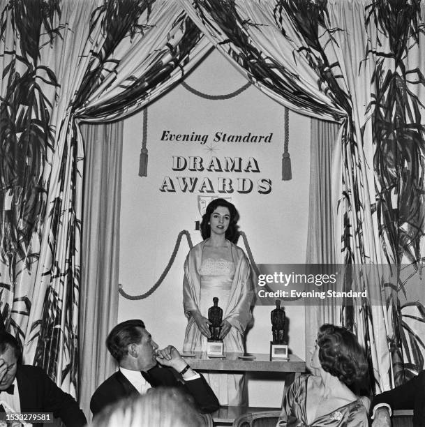 British actress and singer Marlys Watters on stage at the Evening Standard Drama Awards for 1958 to accept the Best Musical award for 'West Side...