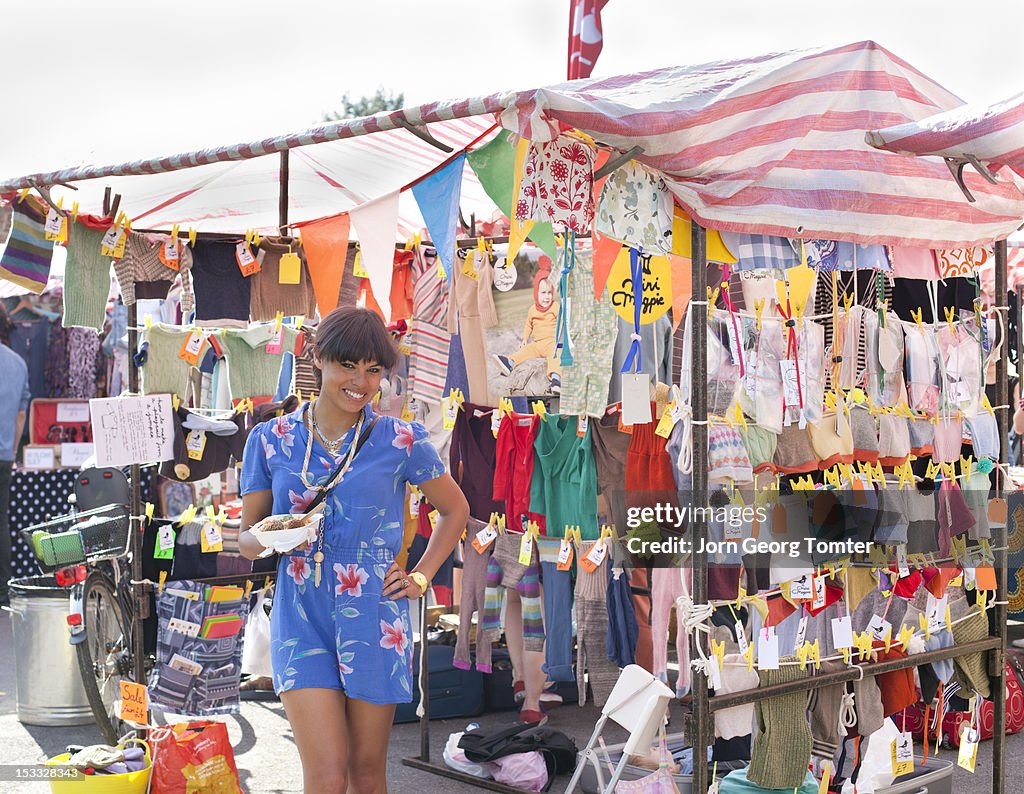 Young woman at her market stall