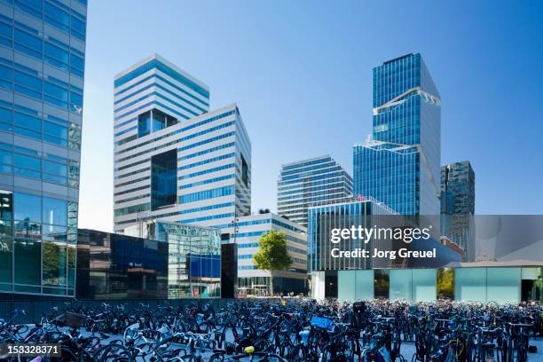 bike park place and modern office buildings - netherlands skyline stock pictures, royalty-free photos & images