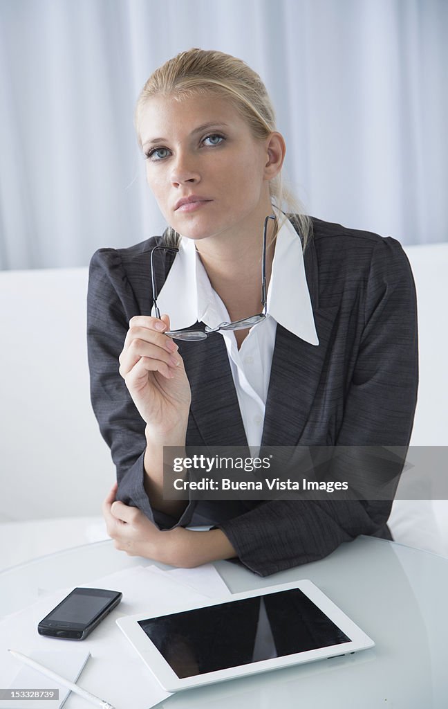 Business woman with cell phone and tablet