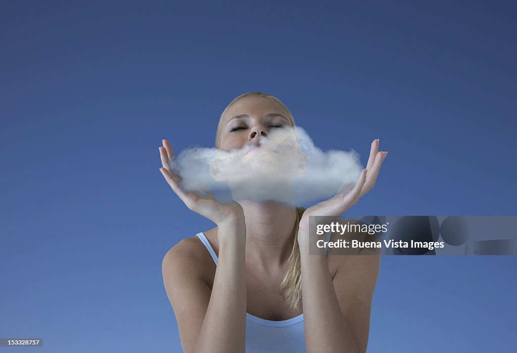 Woman with a cloud in her hands