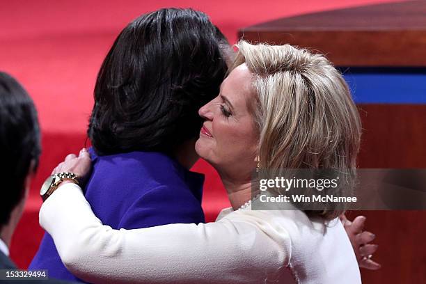 Ann Romney wife of Republican presidential candidate, former Massachusetts Gov. Mitt Romney and First lady Michelle Obama hug prior to the...