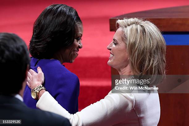 Ann Romney wife of Republican presidential candidate, former Massachusetts Gov. Mitt Romney and First lady Michelle Obama hug prior to the...