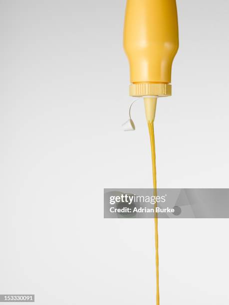 squirting mustard - squirting foto e immagini stock