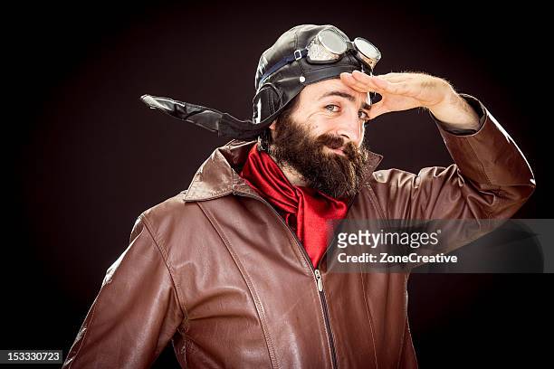 funny old style pilot in "as commanded" pose - flying goggles ストックフォトと画像