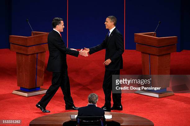 Democratic presidential candidate, U.S. President Barack Obama shakes hands with Republican presidential candidate, former Massachusetts Gov. Mitt...