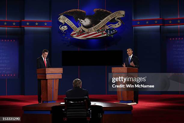 Democratic presidential candidate, U.S. President Barack Obama speaks as Republican presidential candidate, former Massachusetts Gov. Mitt Romney...