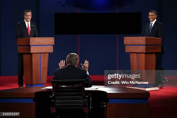 Debate moderator Jim Lehrer speaks to Democratic presidential candidate, U.S. President Barack Obama and Republican presidential candidate, former...