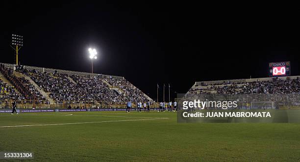 Brazilian and Argentinian players warm up during their America's Super Derby football match at the Centenario stadium in Resistencia, Chaco, some 950...