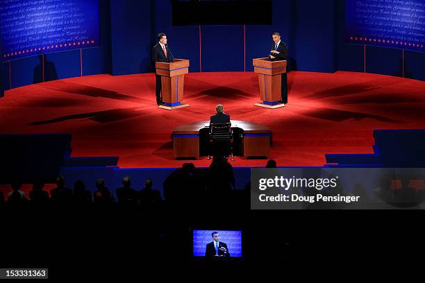 Democratic presidential candidate, U.S. President Barack Obama speaks as Republican presidential candidate, former Massachusetts Gov. Mitt Romney...