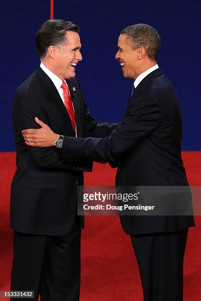 Democratic presidential candidate, U.S. President Barack Obama shakes hands with Republican presidential candidate, former Massachusetts Gov. Mitt...