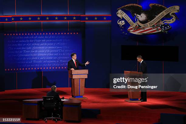 Republican presidential candidate, former Massachusetts Gov. Mitt Romney speaks as Democratic presidential candidate, U.S. President Barack Obama...