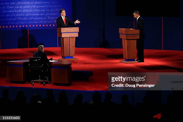 Republican presidential candidate, former Massachusetts Gov. Mitt Romney speaks as Democratic presidential candidate, U.S. President Barack Obama...