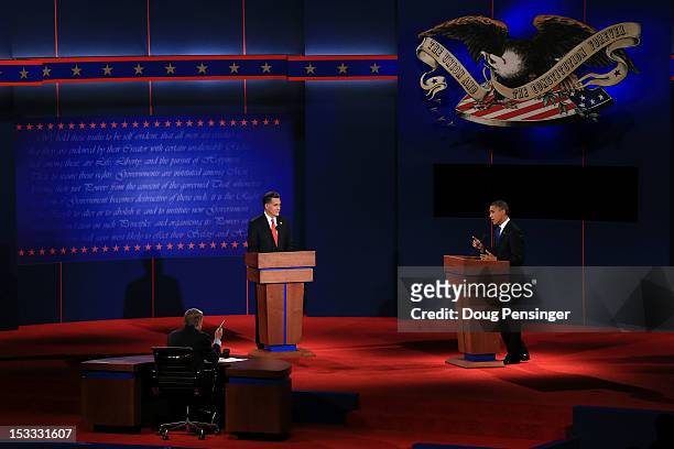 Democratic presidential candidate, U.S. President Barack Obama speaks as Republican presidential candidate, former Massachusetts Gov. Mitt Romney...