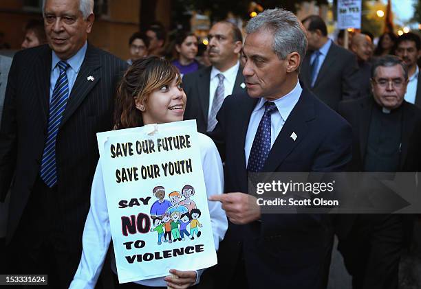 Chicago Mayor Rahm Emanuel speaks with Edith Patino during an anti-violence march on October 3, 2012 in Chicago, Illinois. As of September 31,...