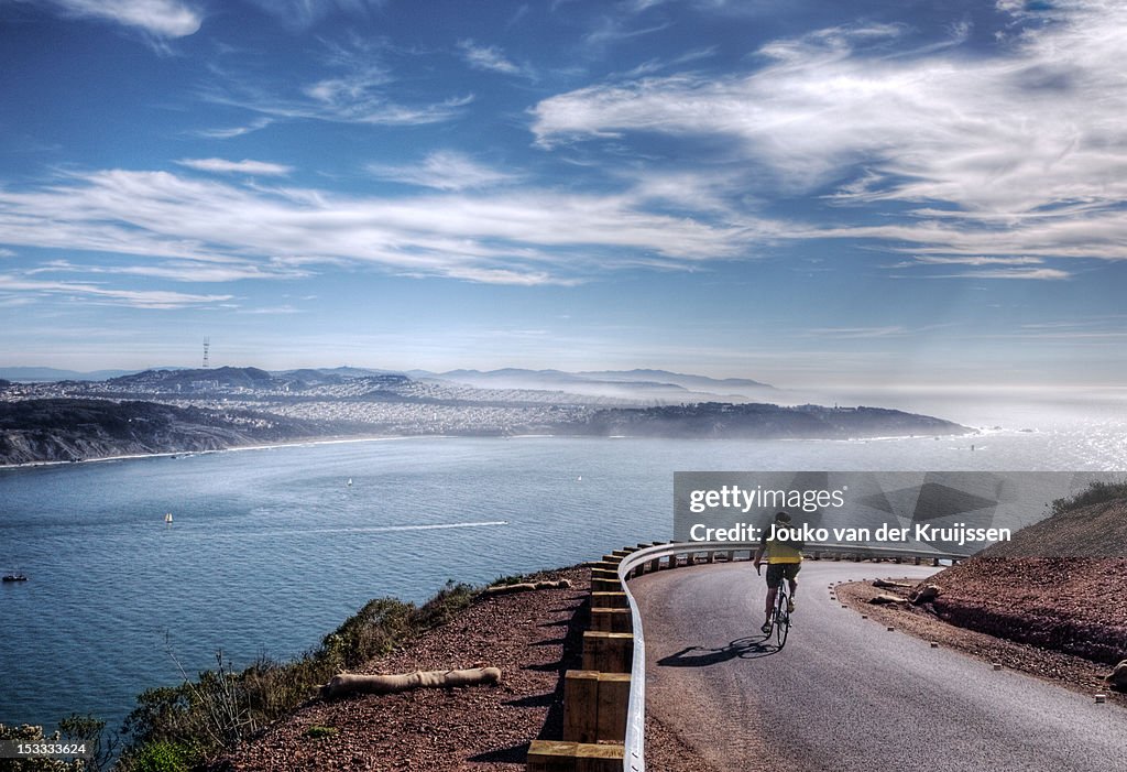 Lone biker turning corner