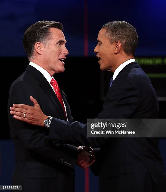 Democratic presidential candidate, U.S. President Barack Obama shakes hands with Republican presidential candidate, former Massachusetts Gov. Mitt...