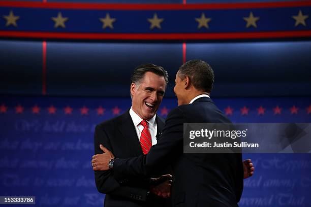 Democratic presidential candidate, U.S. President Barack Obama shakes hands with Republican presidential candidate, former Massachusetts Gov. Mitt...