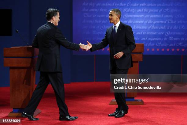 Democratic presidential candidate, U.S. President Barack Obama shakes hands with Republican presidential candidate, former Massachusetts Gov. Mitt...