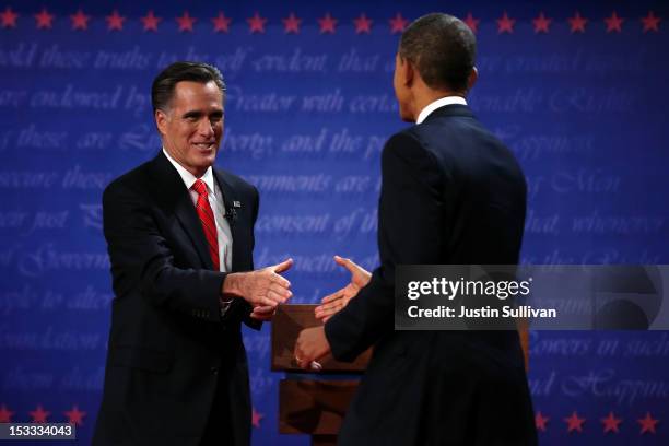 Democratic presidential candidate, U.S. President Barack Obama shakes hands with Republican presidential candidate, former Massachusetts Gov. Mitt...