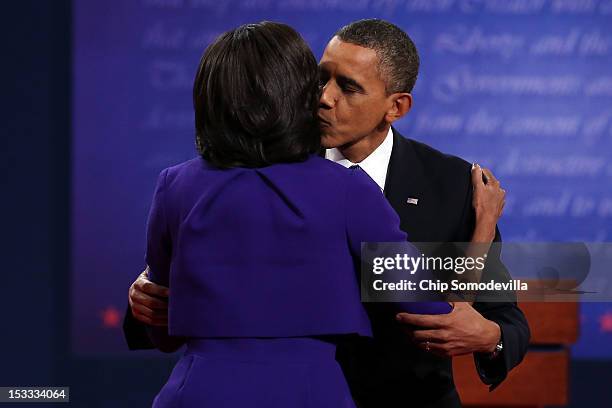 Democratic presidential candidate, U.S. President Barack Obama kisses his wife and First lady Michelle Obama after the Presidential Debate at the...