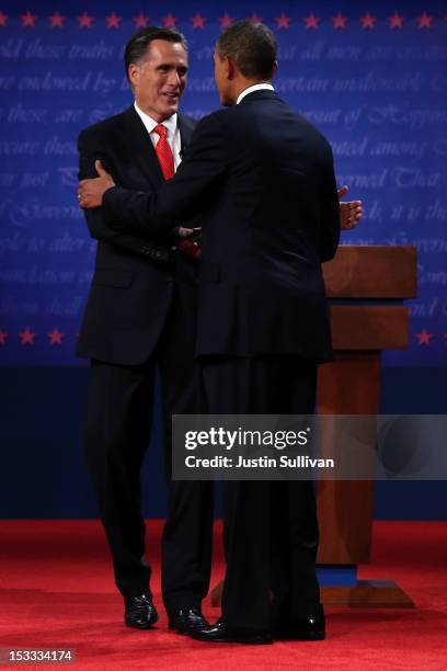 Democratic presidential candidate, U.S. President Barack Obama shakes hands with Republican presidential candidate, former Massachusetts Gov. Mitt...