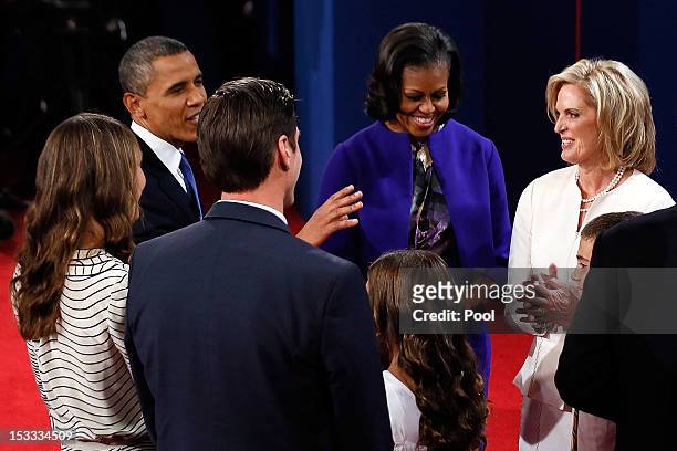 President Barack Obama talks with first lady Michelle Obama, Ann Romney , and Matt Romney after the conclusion of the Presidential Debate at the...