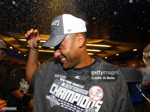 Derek Jeter of the New York Yankees celebrates winning the American League East Division Championship after their 14-2 win against the Boston Red Sox...