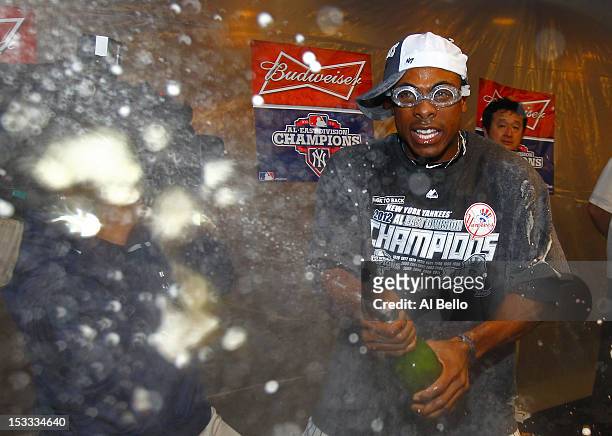 Curtis Granderson of the New York Yankees celebrates winning the American League East Division Championship after their 14-2 win against the Boston...