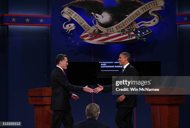 Democratic presidential candidate, U.S. President Barack Obama shakes hands with Republican presidential candidate, former Massachusetts Gov. Mitt...