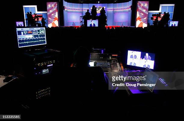 Sound engineer watches the Presidential Debate between Democratic presidential candidate, U.S. President Barack Obama and Republican presidential...