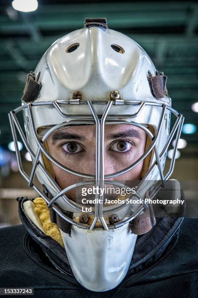 close up of caucasian hockey goalie in mask - ice hockey close up stock pictures, royalty-free photos & images
