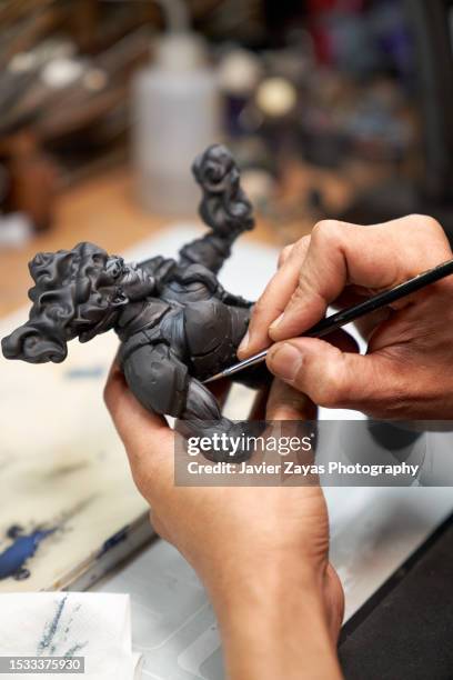 middle aged latin man painting 3d printed figure - rpg maker stock pictures, royalty-free photos & images