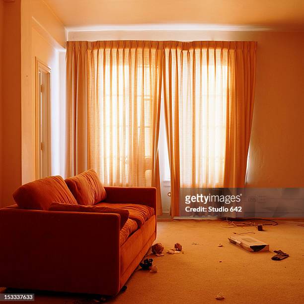 sofa in messy living room - messy room stock pictures, royalty-free photos & images