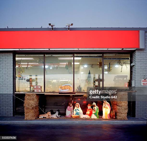 christian nativity in front of store - christmas decorations in store stock pictures, royalty-free photos & images