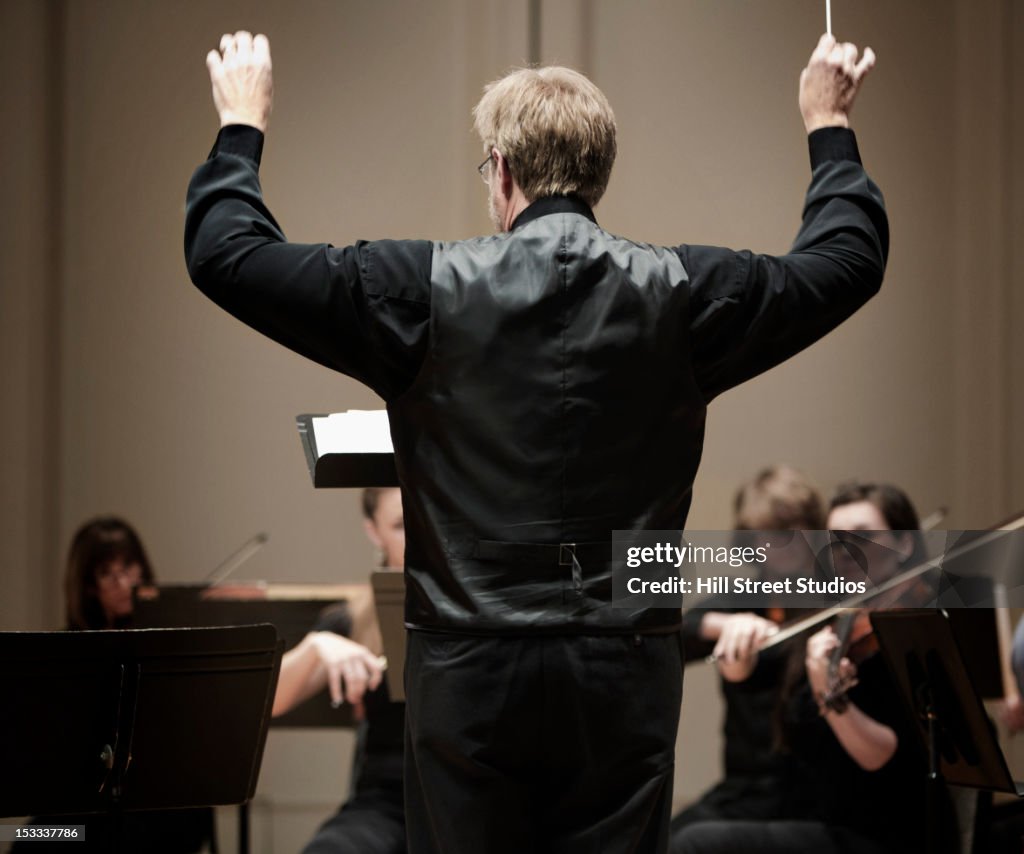 Conductor leading orchestra