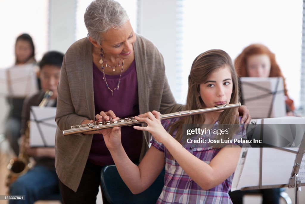 Student learning to play the flute