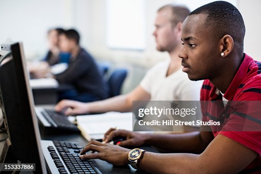 Students studying in computer lab Students studying in computer lab