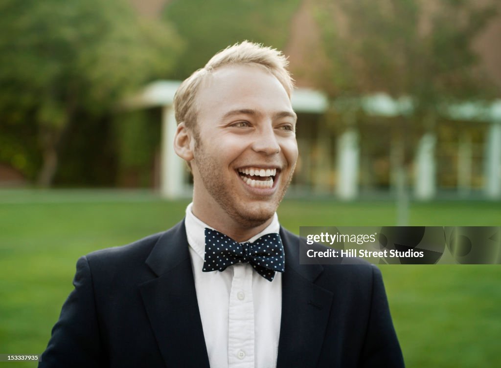 Smiling man in suit and bow tie