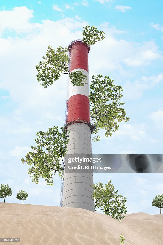 Branches growing from factory smoke stack